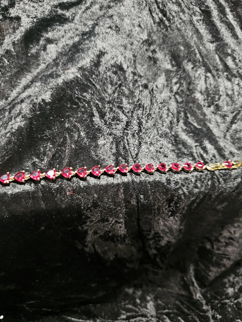 Gold-Plated Bracelet with Red Hearts Gemstones. Has a extender